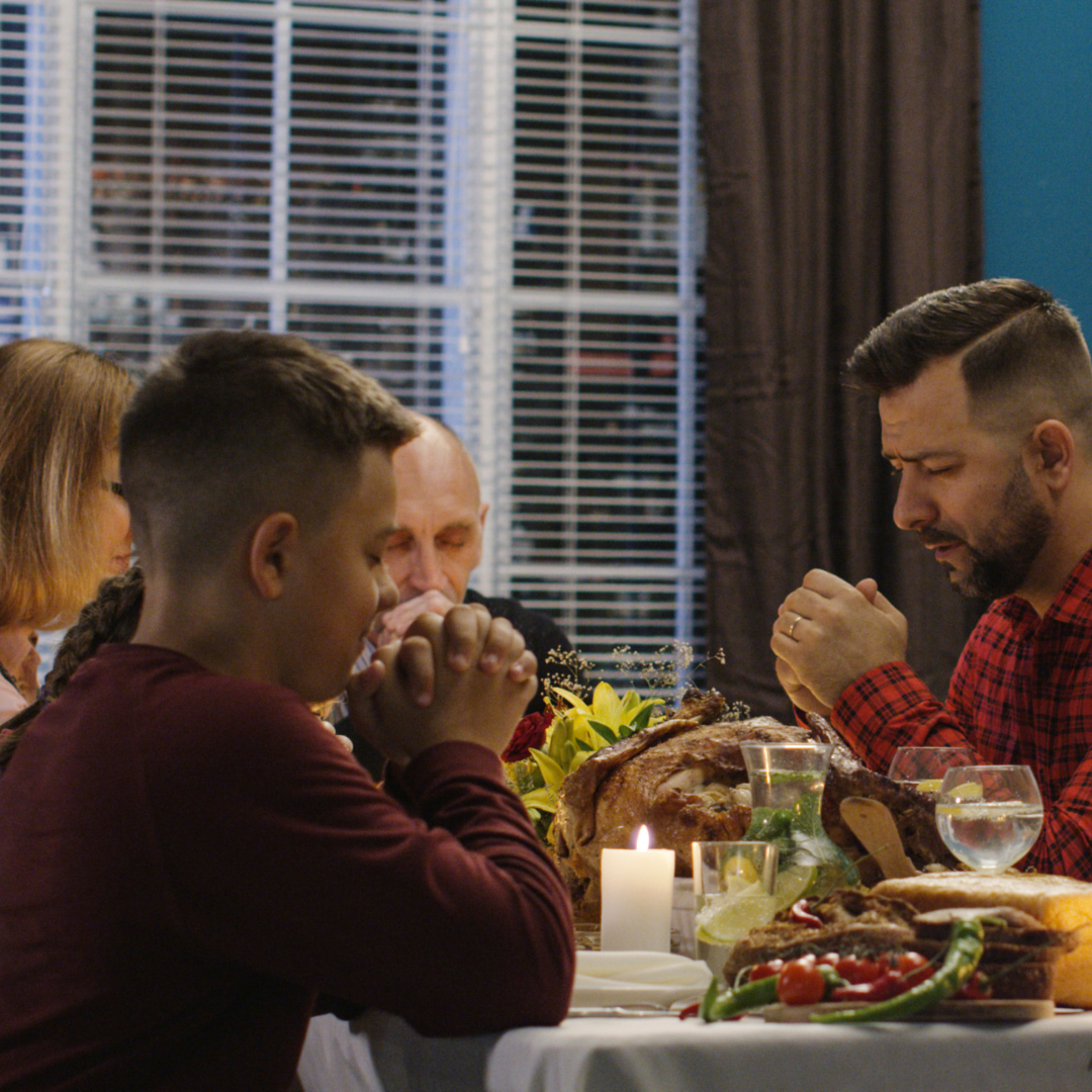 2family praying before a meal