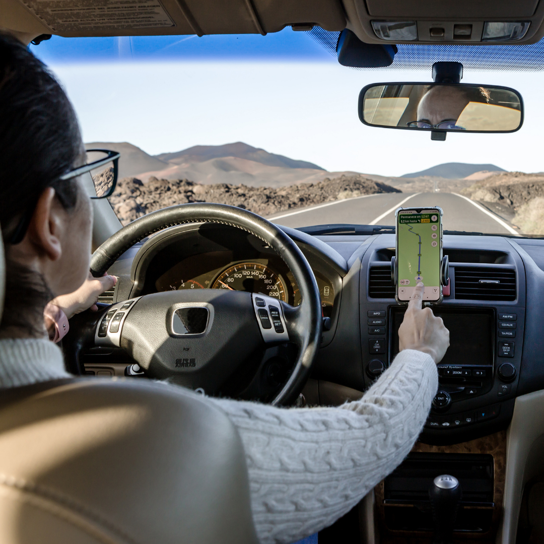 woman using GPS as she drives