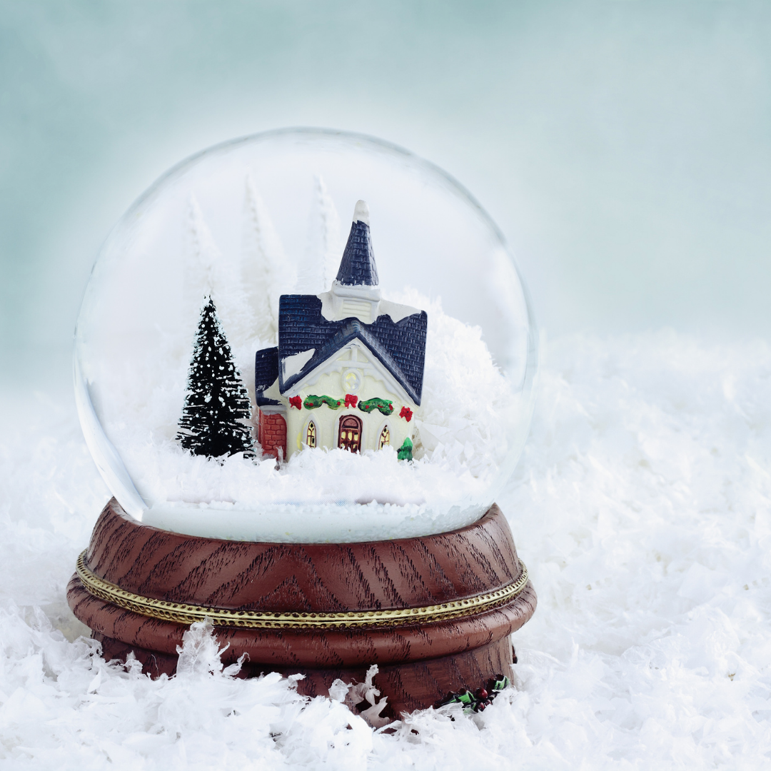 snow globe with church and pine tree