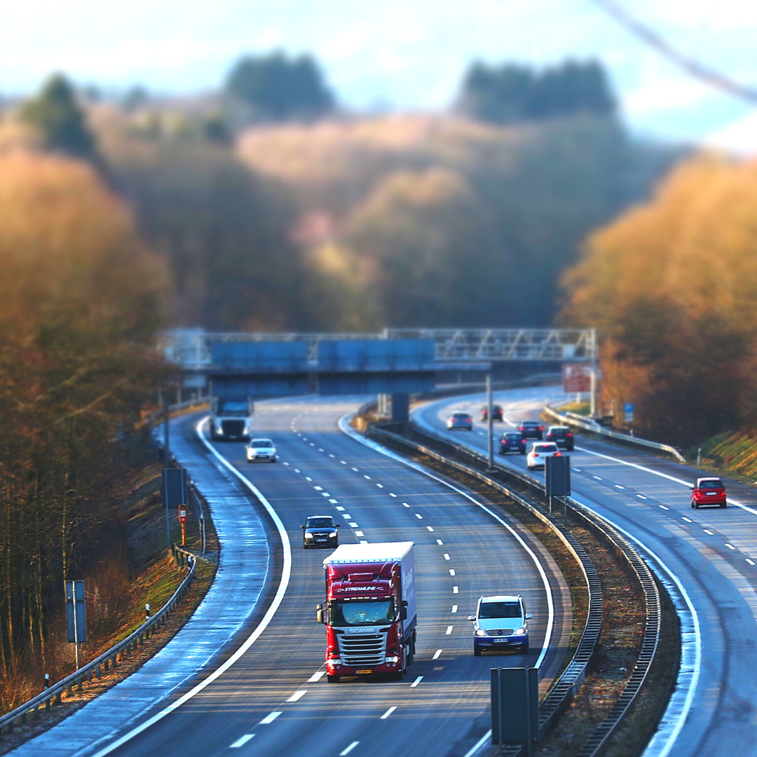 cars and trucks on a winding highway