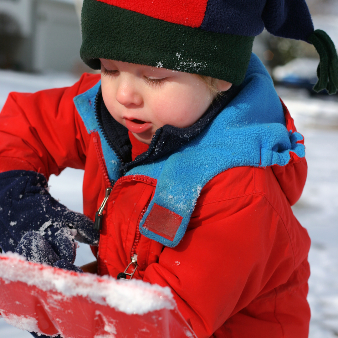 small child shoveling show