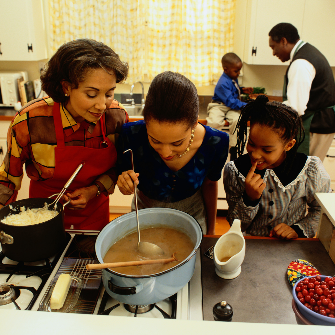 family preparing Thanksgiving dinner