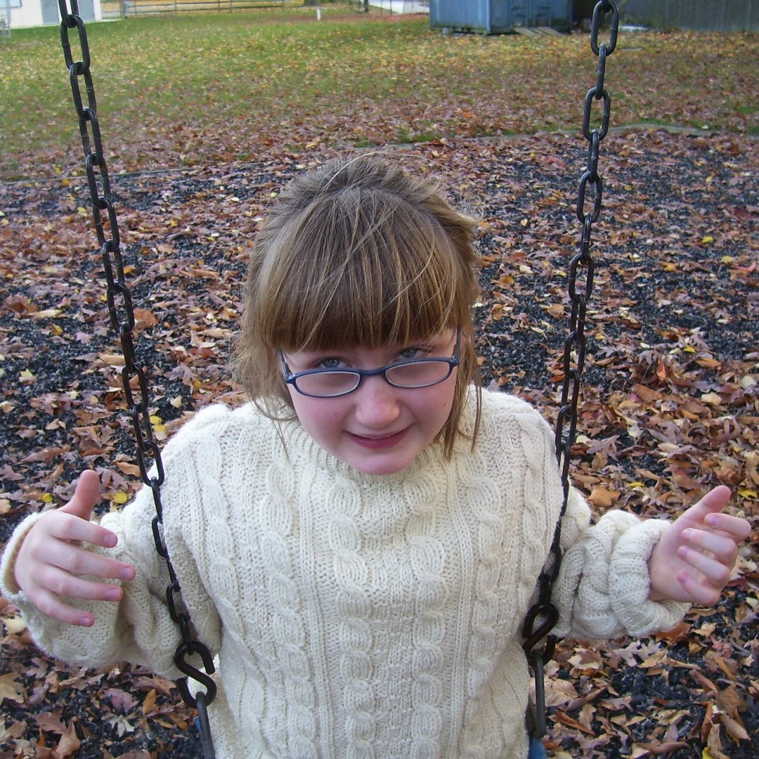 little girl on swings
