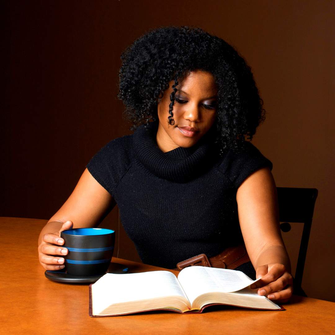 woman drinking coffee and reading the Bible