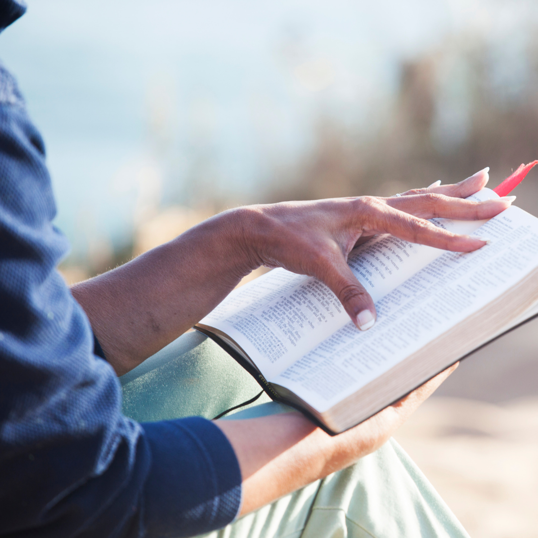 close up of woman reading Bible