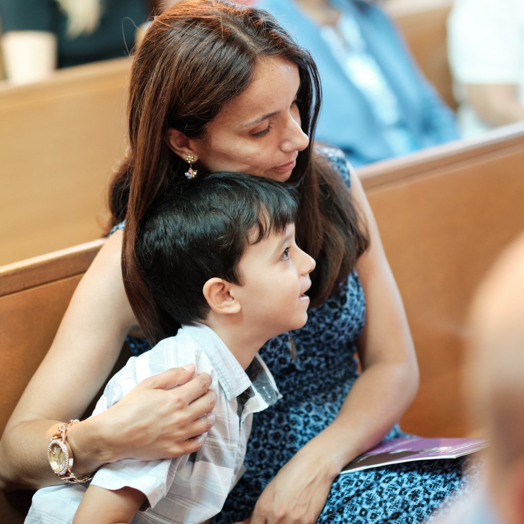 mom with young boy at Mass