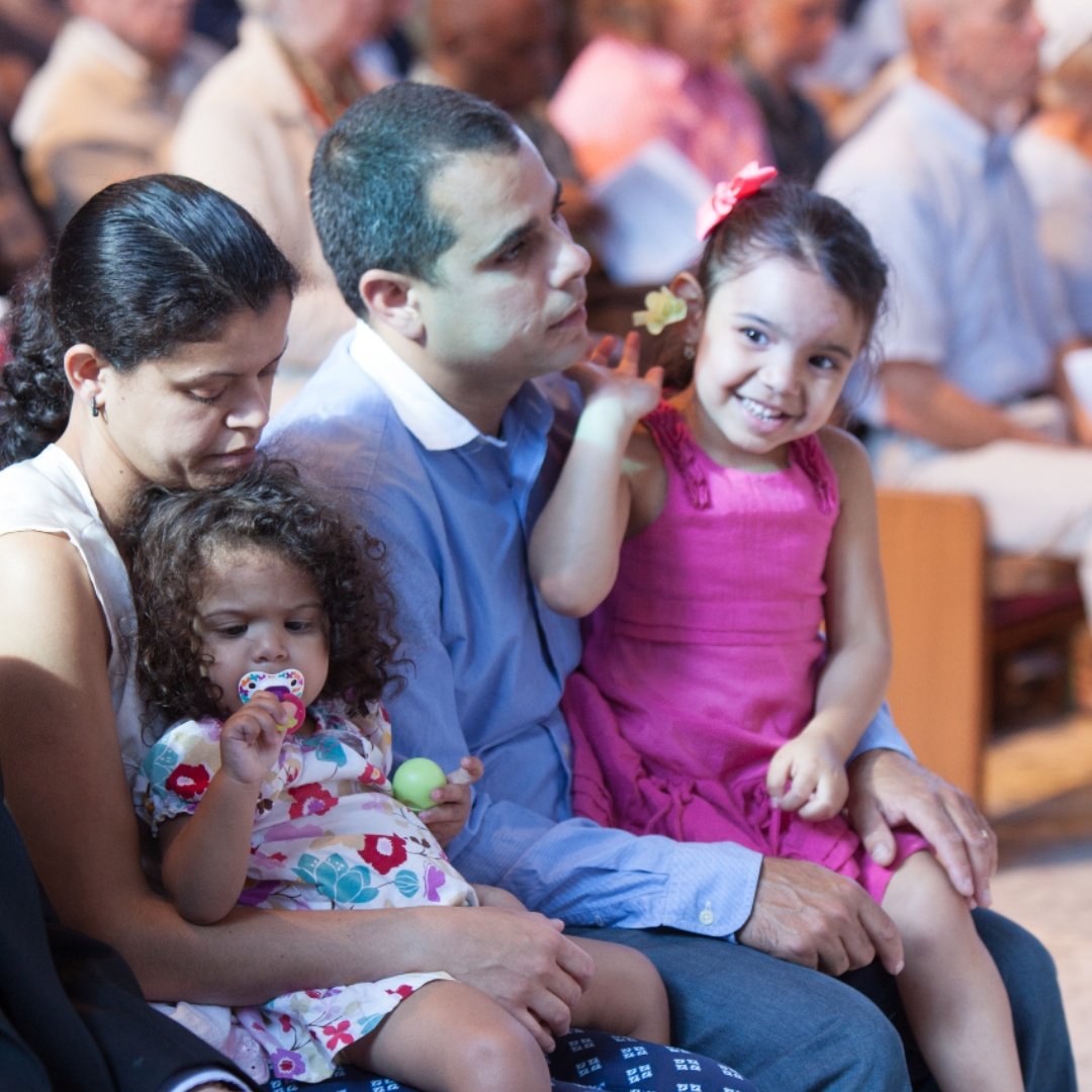 family with little children at Mass