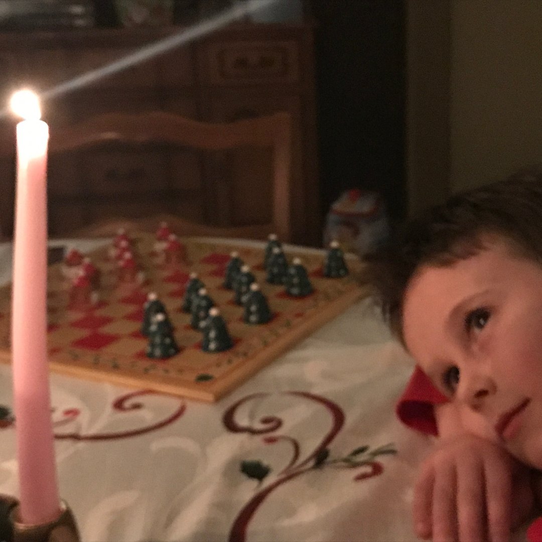 child looking at Advent wreath