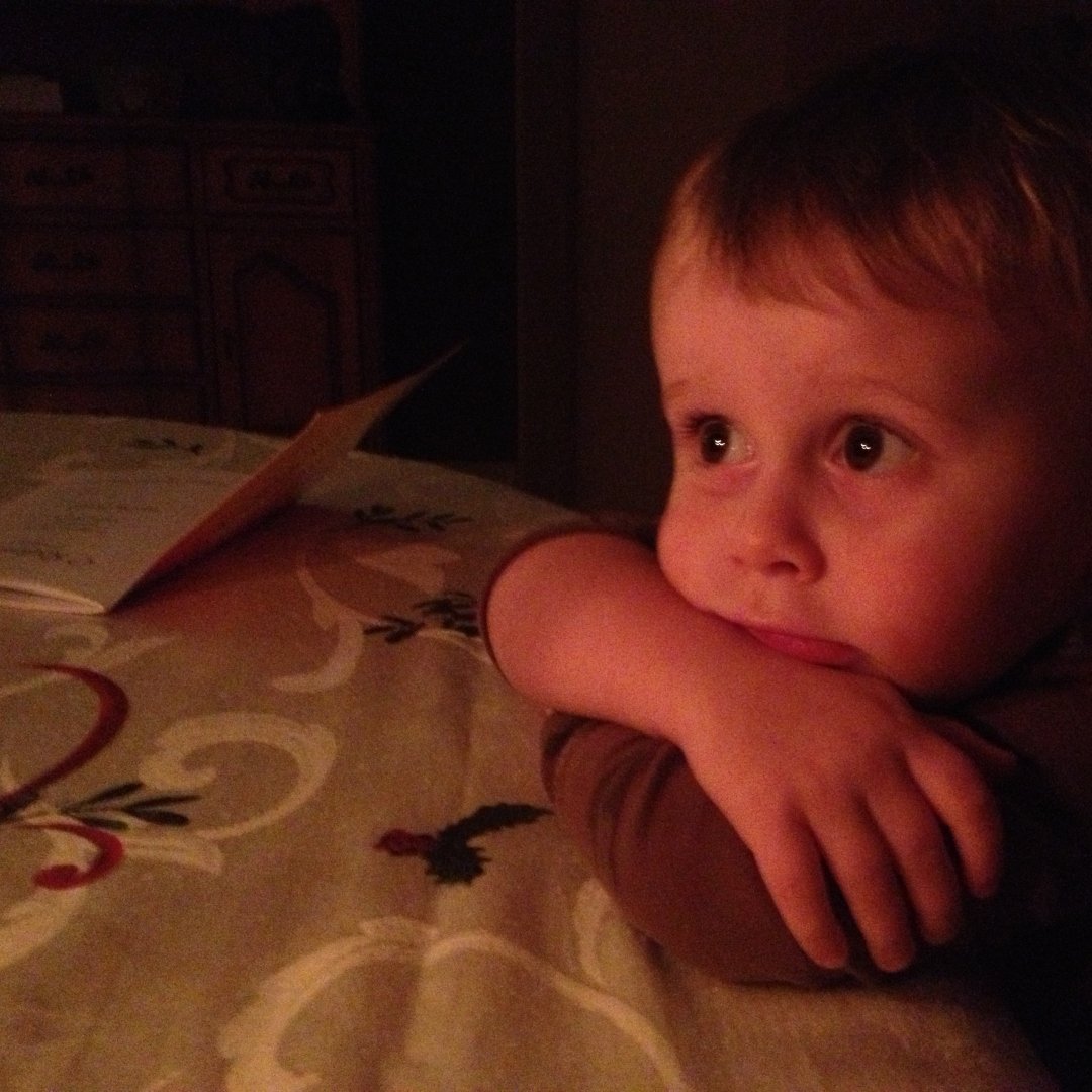 child looking at Advent wreath