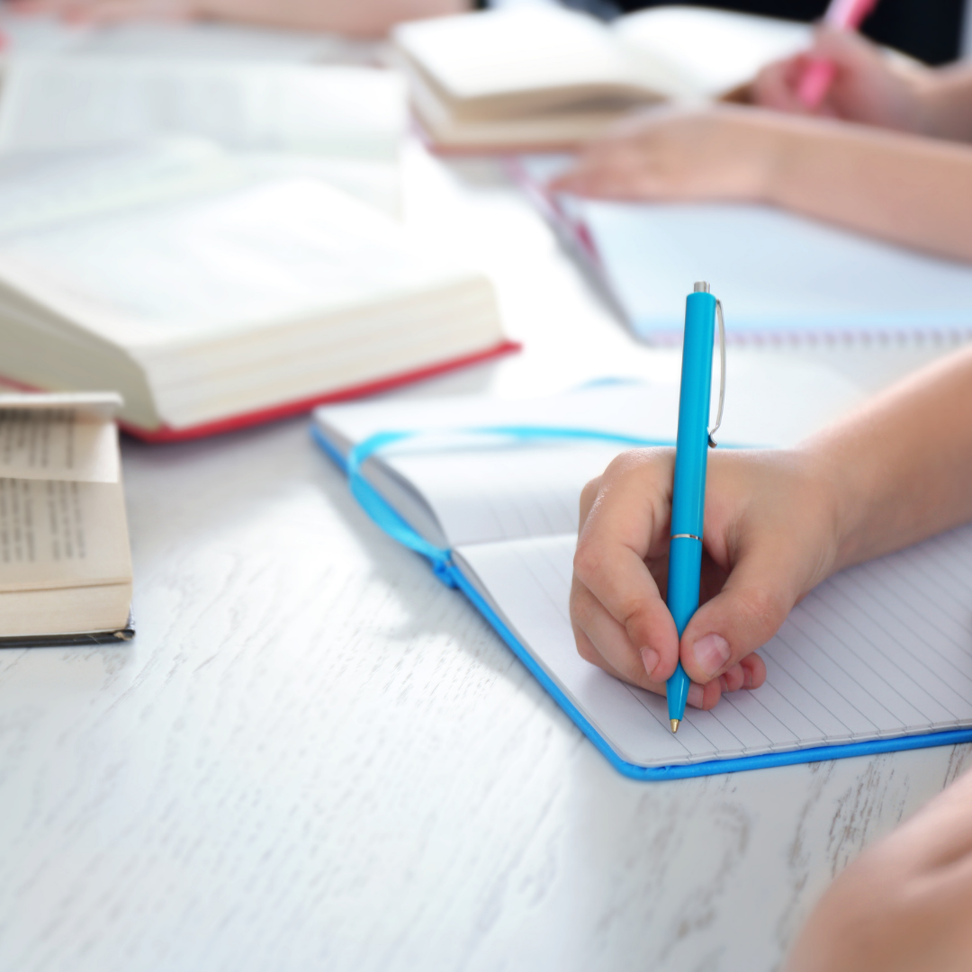 children writing in journals