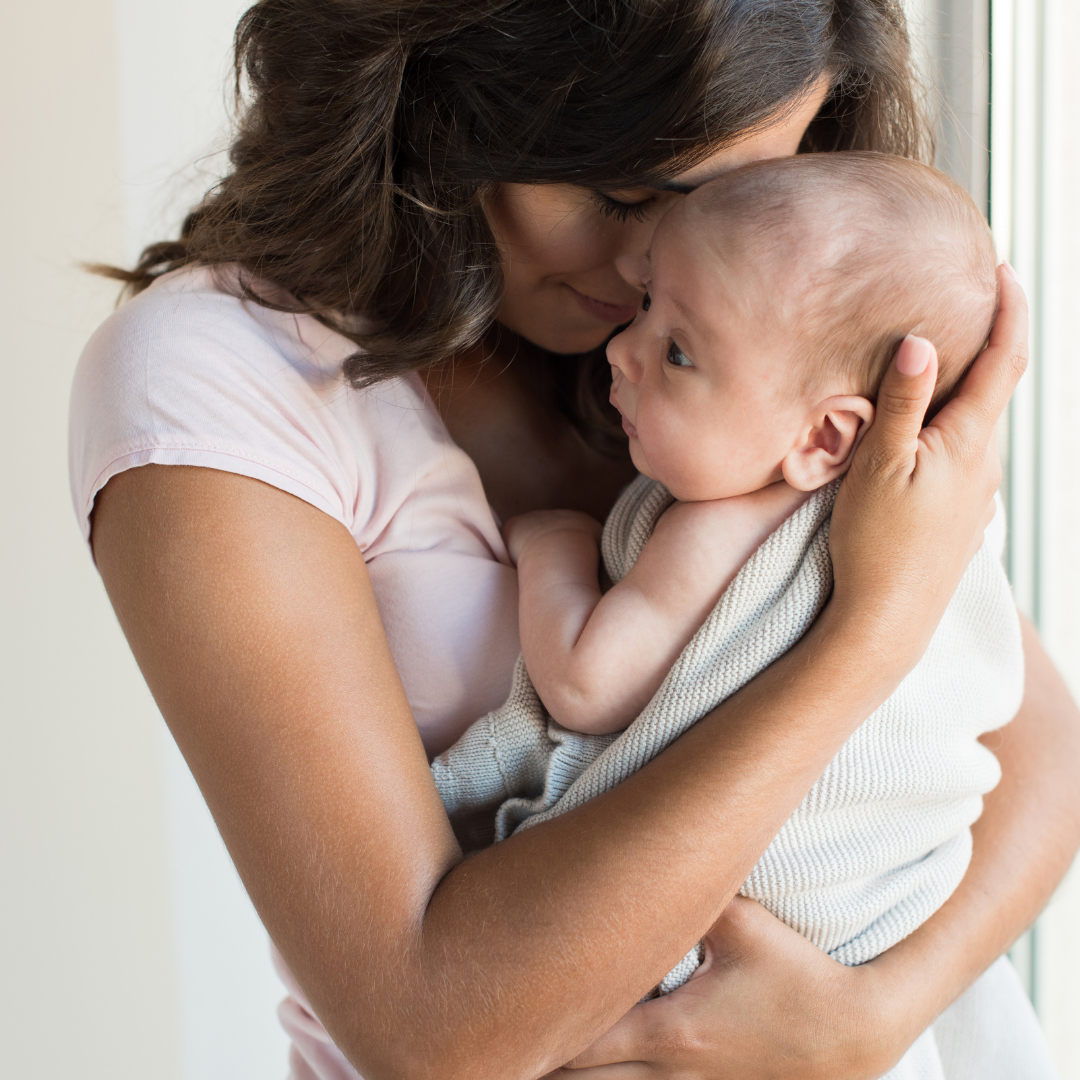 woman holding newborn