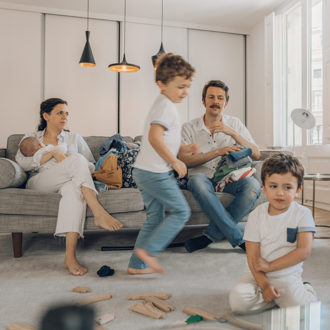 family running around in messy house