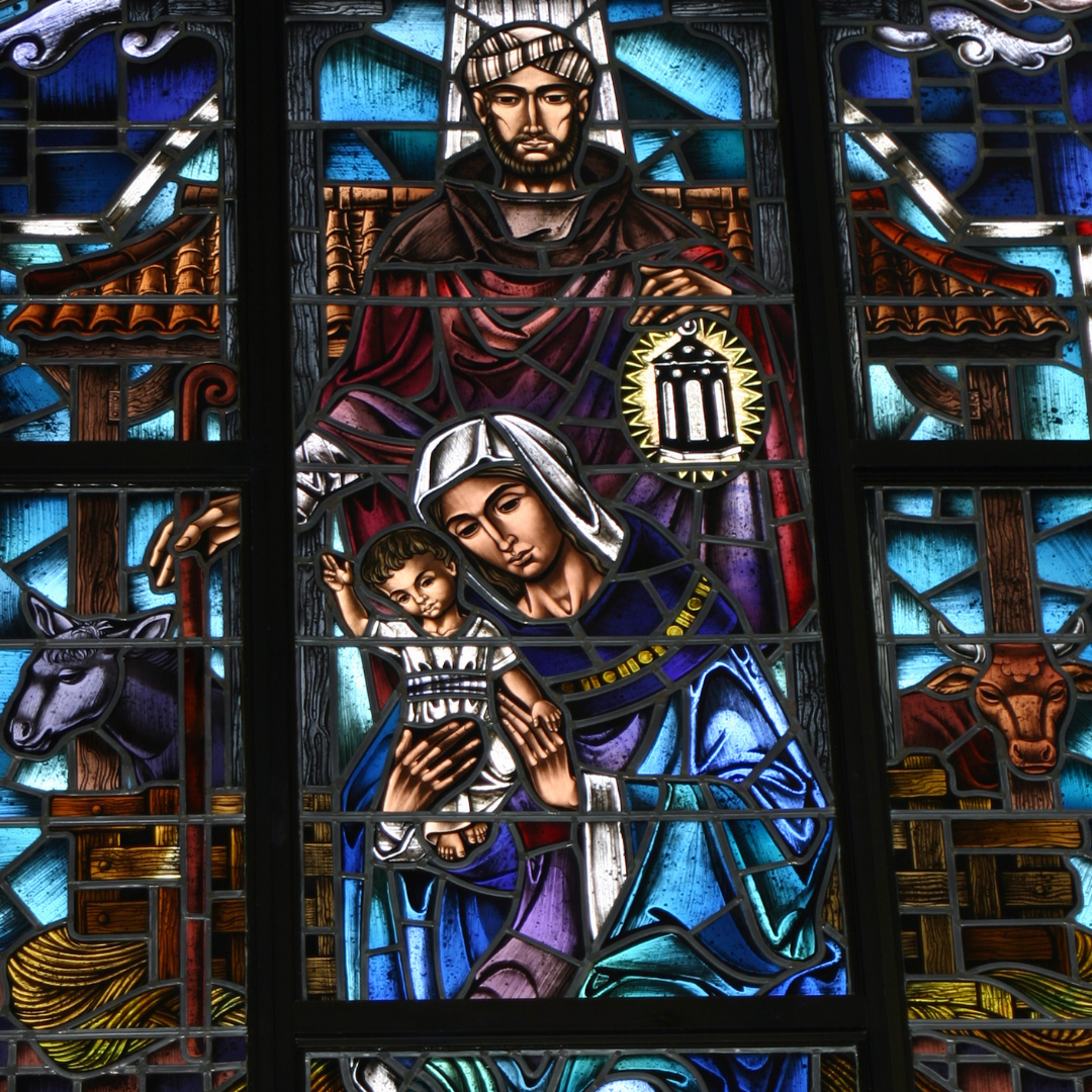 stained glass window depicting the Holy Family