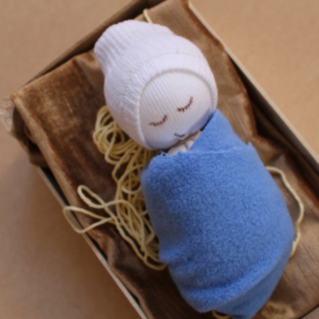 20211228 MMcConkey sock baby jesus in clementine crib
