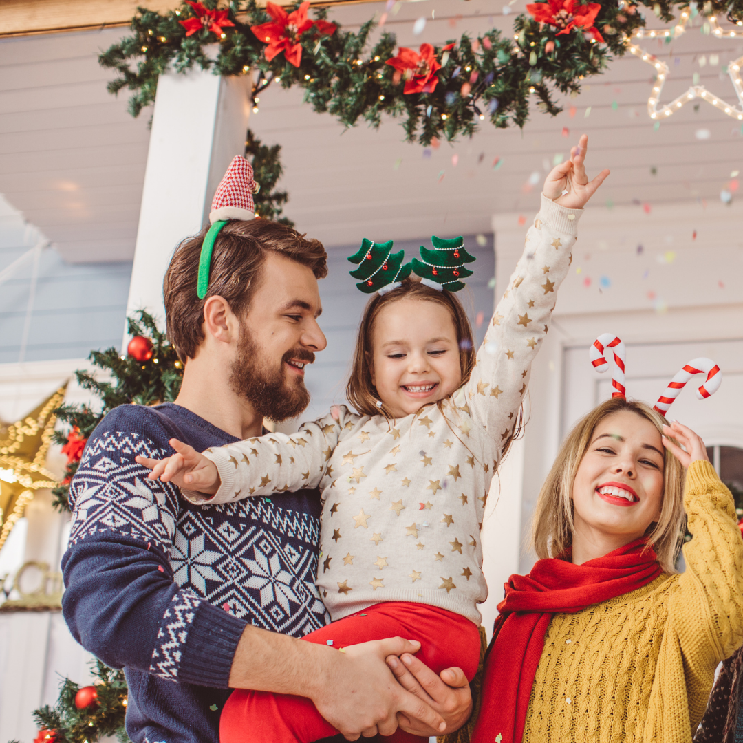 family celebrating with festive headbands