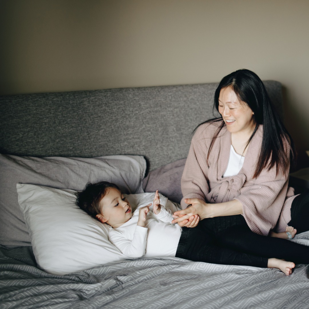 Mom and child talking at bedside