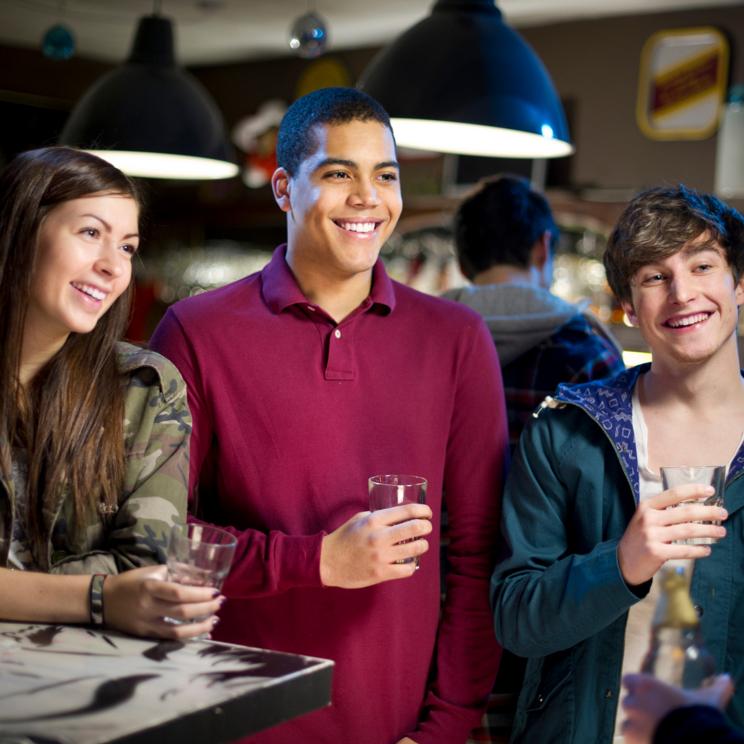 group of young adults with drinks
