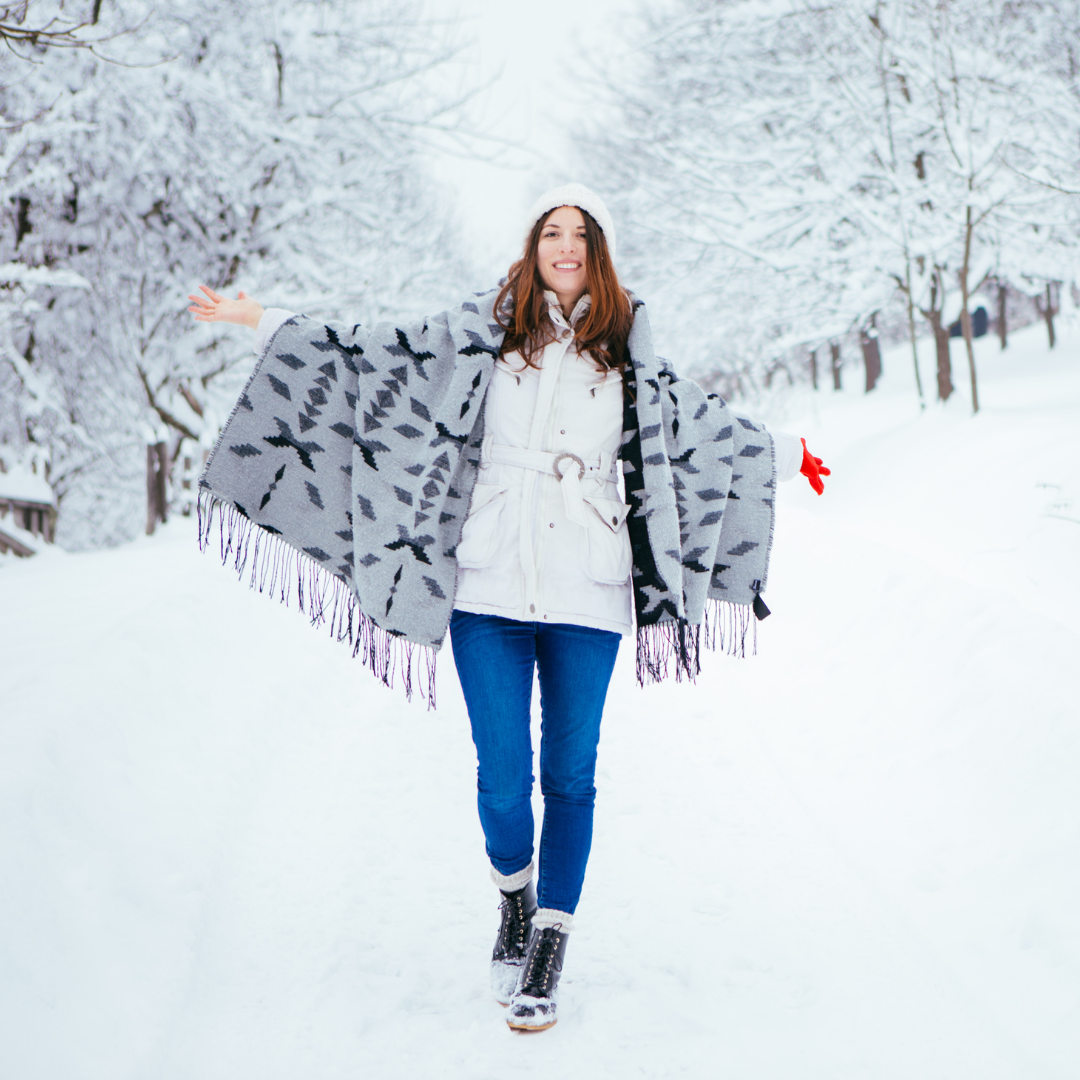 woman walking along a trail in winter