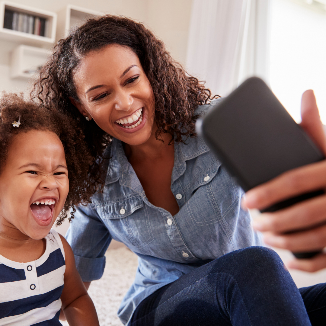 mom and daughter taking a selfie