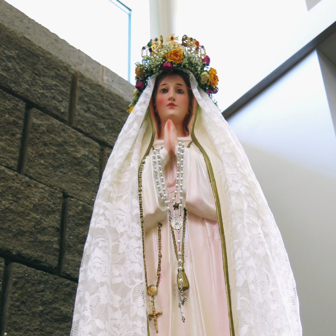 Mary statue crowned with roses