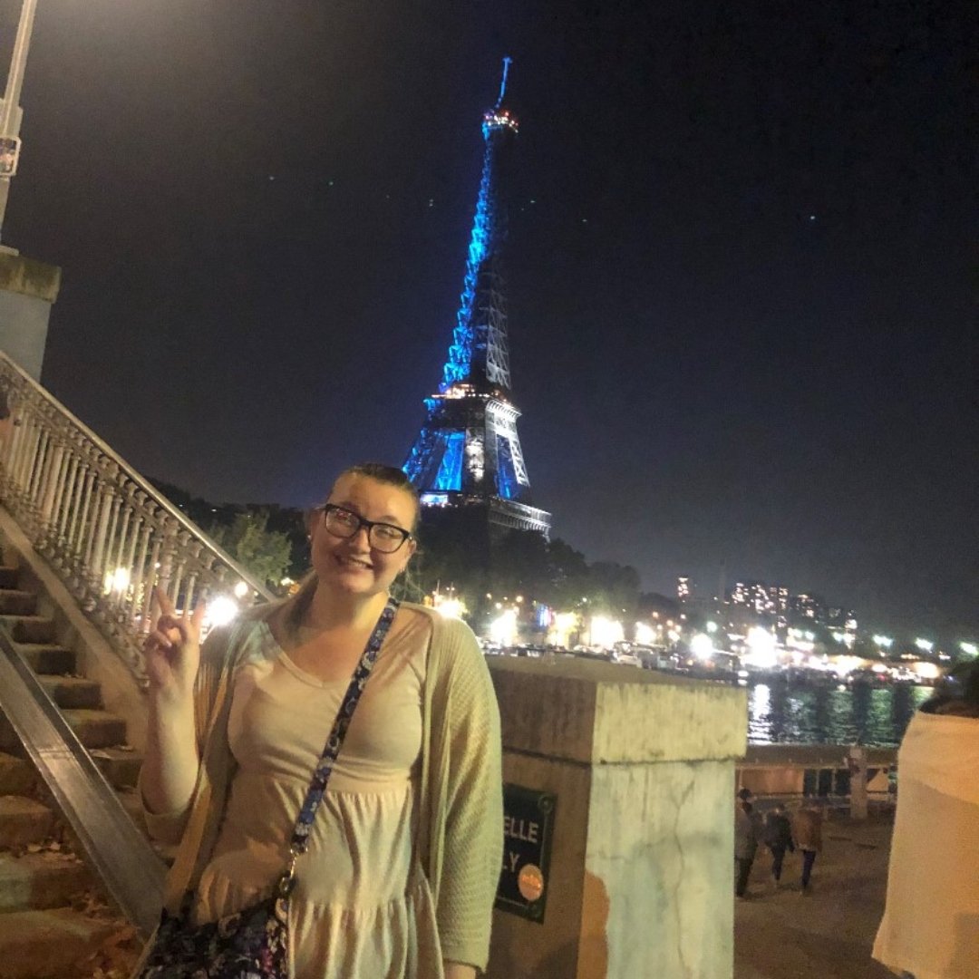 young woman with Eiffel Tower in background