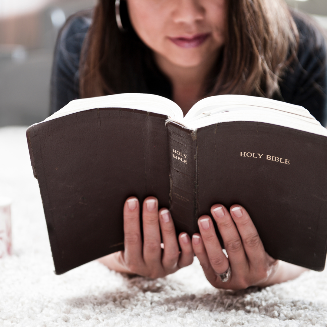 woman reading a Bible