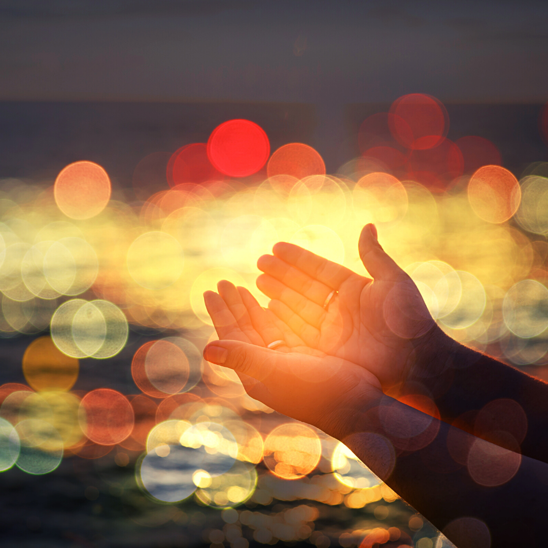 raising hands in prayer
