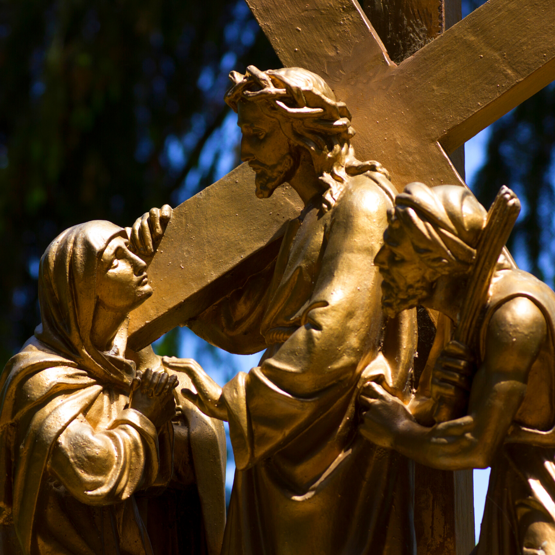 woman meeting Jesus as he carries the cross