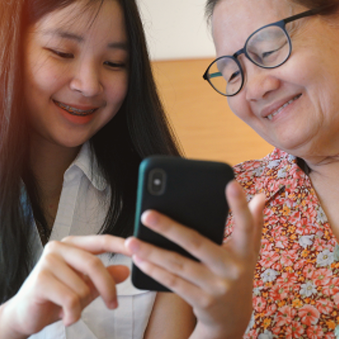 teenager talking with a grandparent