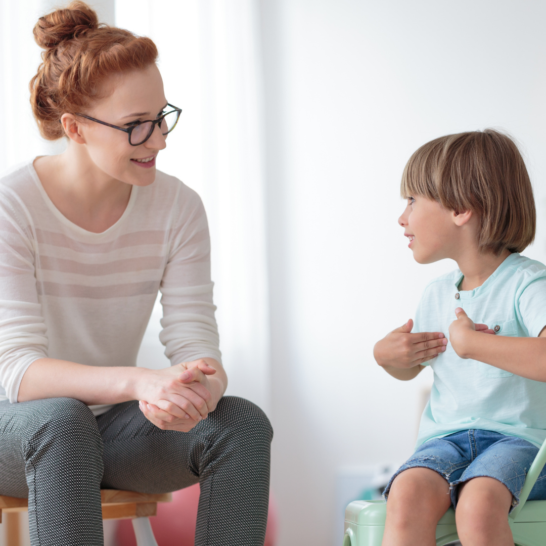 woman listening to small child