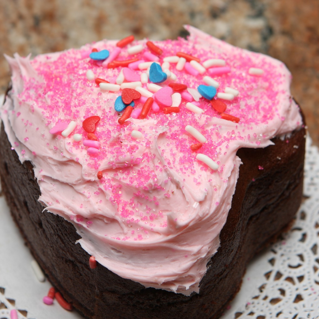 heart shaped cake covered in sprinkles