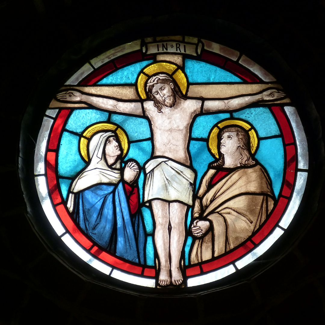 stained glass window showing Crucifixion and Our Lady and St. John