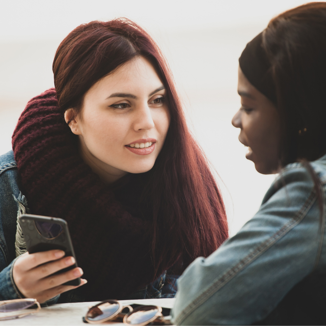 2 young women talking