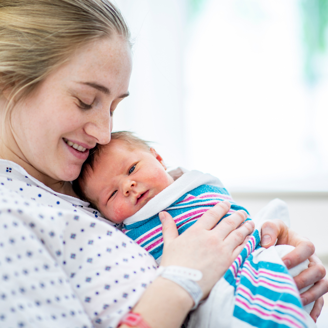 mom holding newborn
