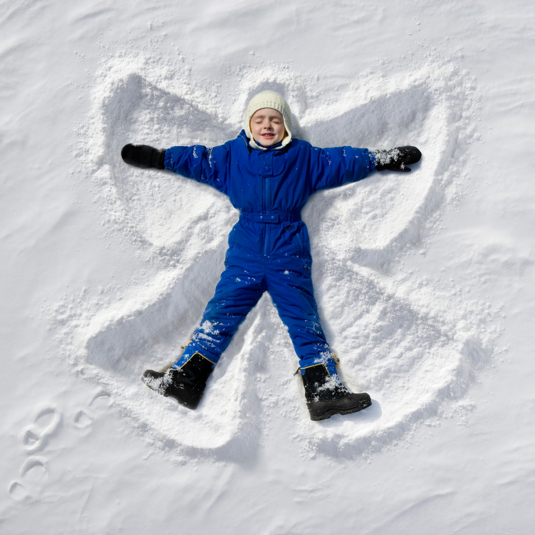 child making a snow angel