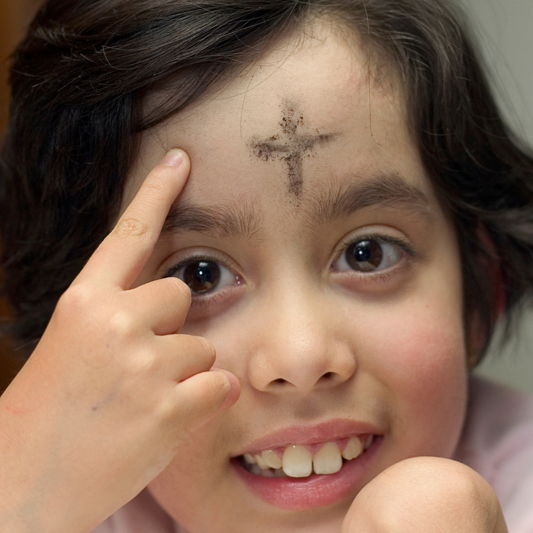 little girl with cross of ashes on her forehead
