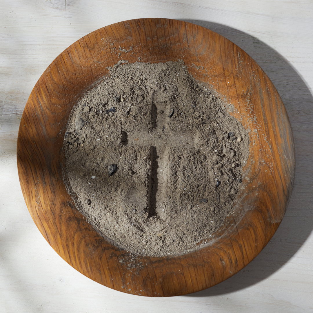 bowl of ashes with cross impressed in it