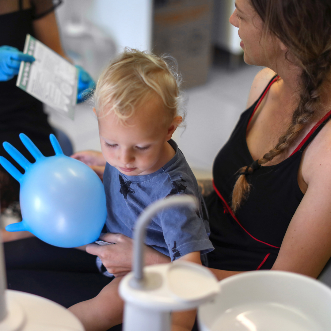 mom with toddler at dentist