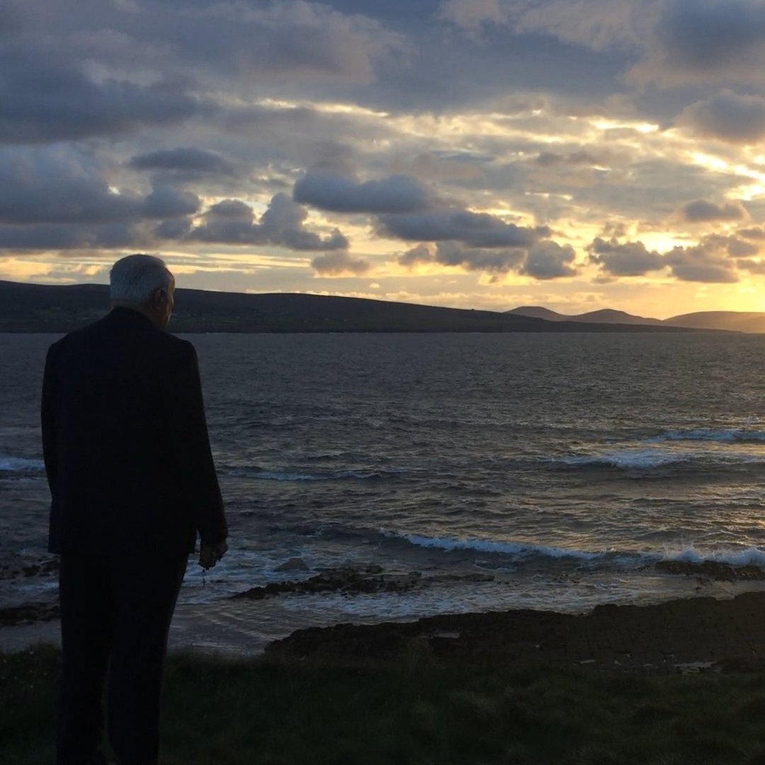 Fr. Peyton standing on the Irish seacoast