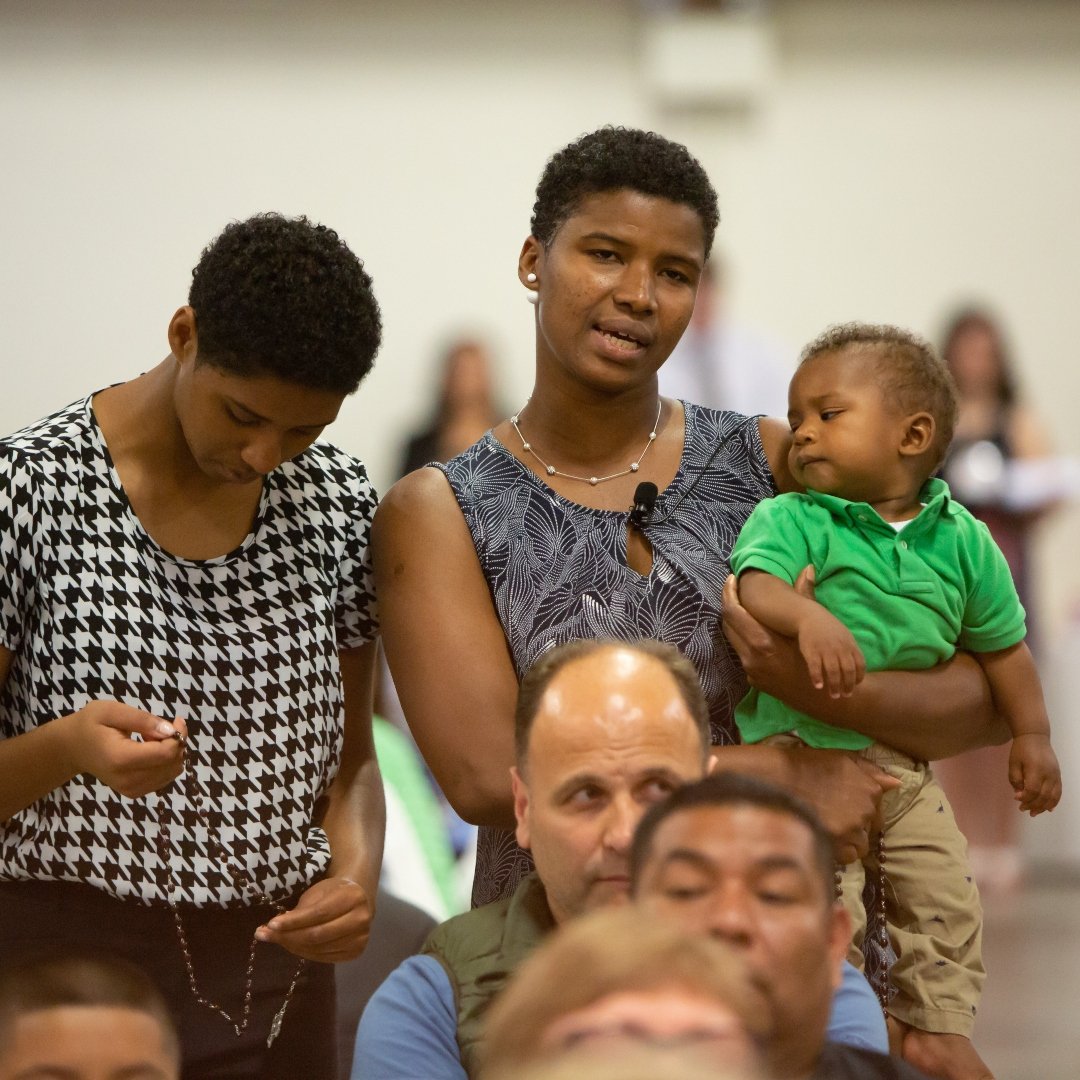 2 women with baby at Mass