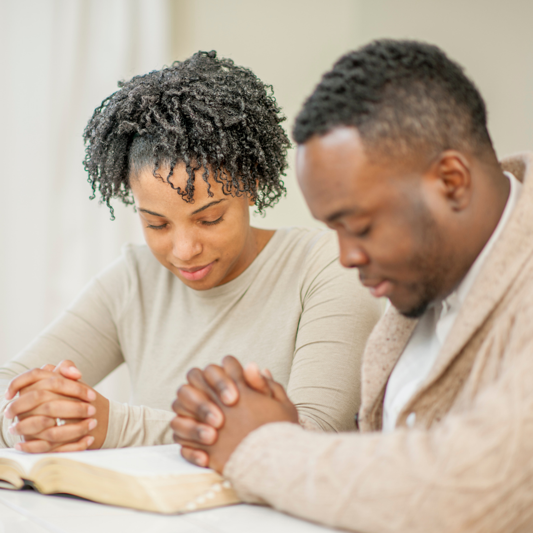 husband and wife praying together