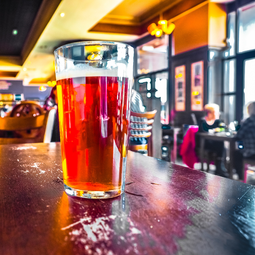 glass of beer on the bar in a pub