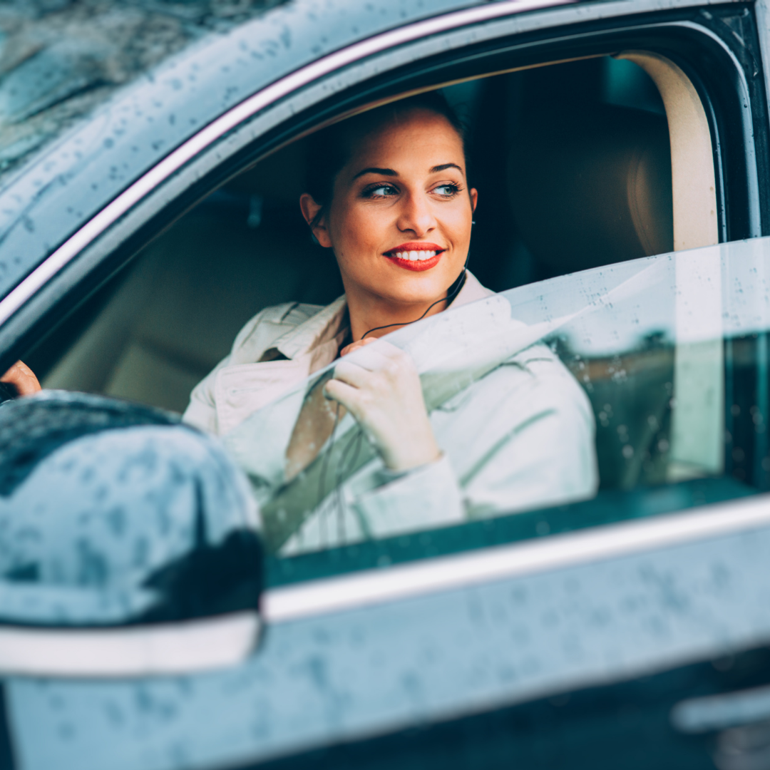 woman sitting behind the wheel