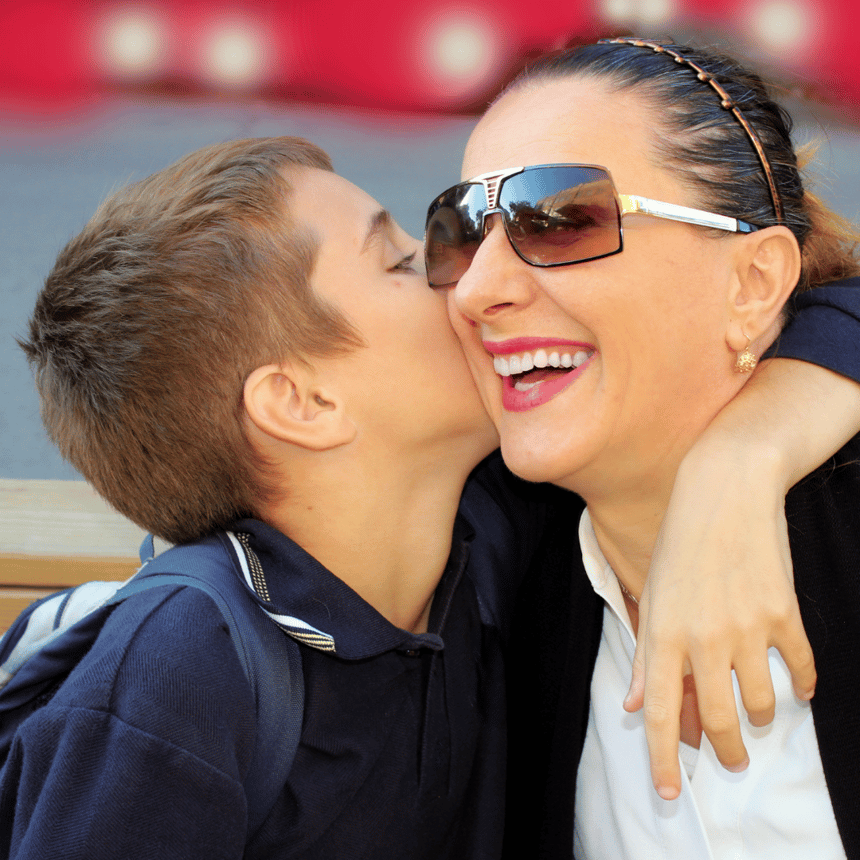 school-age kid hugging mom