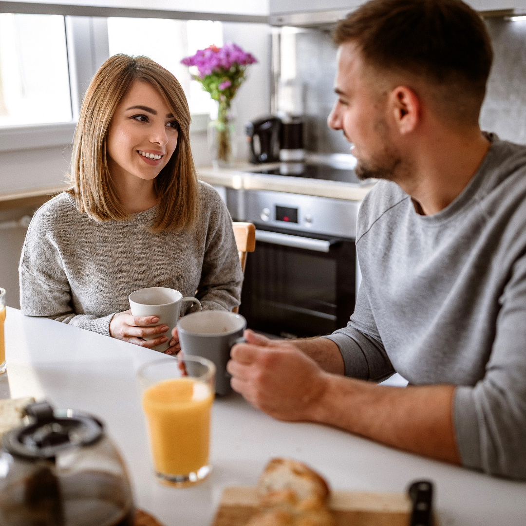 couple having a conversation at breakfast