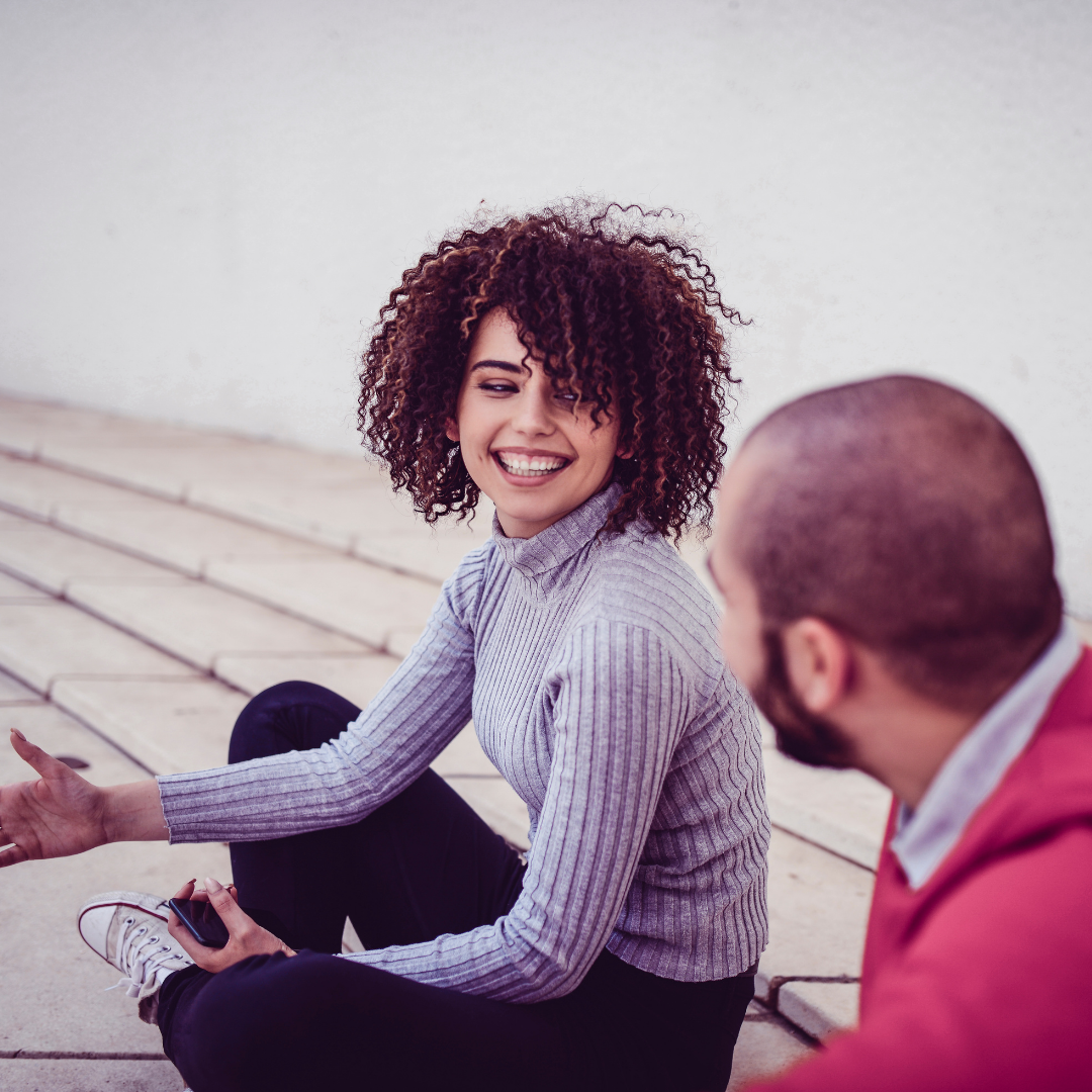 couple sitting on the floor and talking