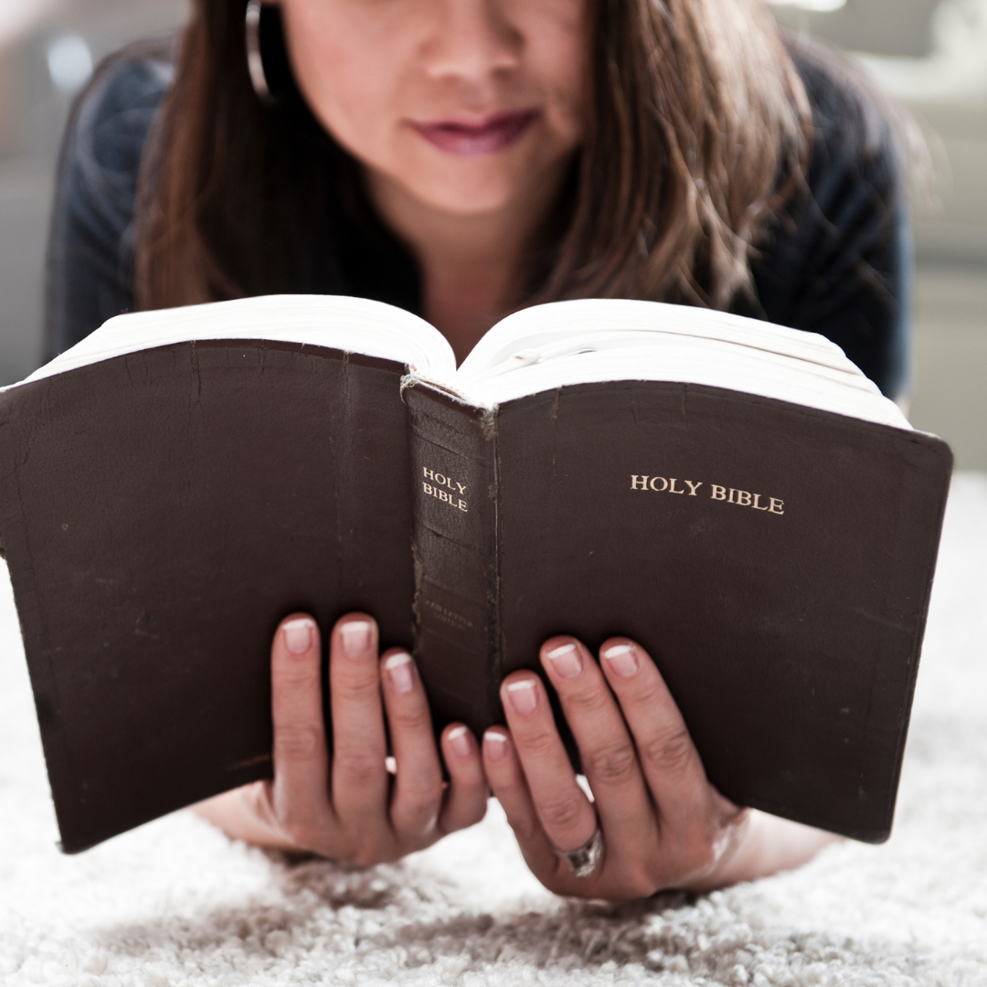 woman reading a Bible