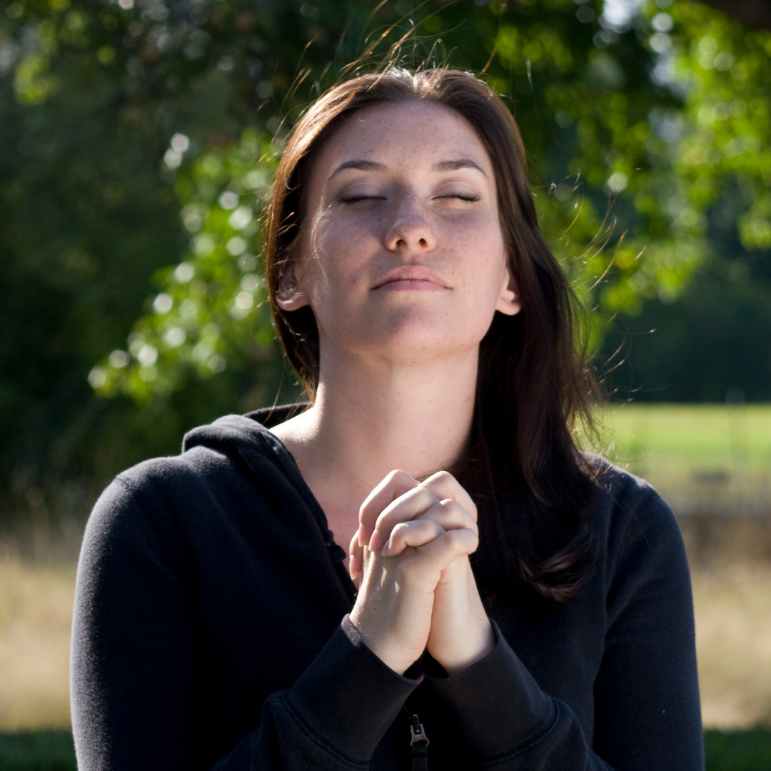 woman praying outside