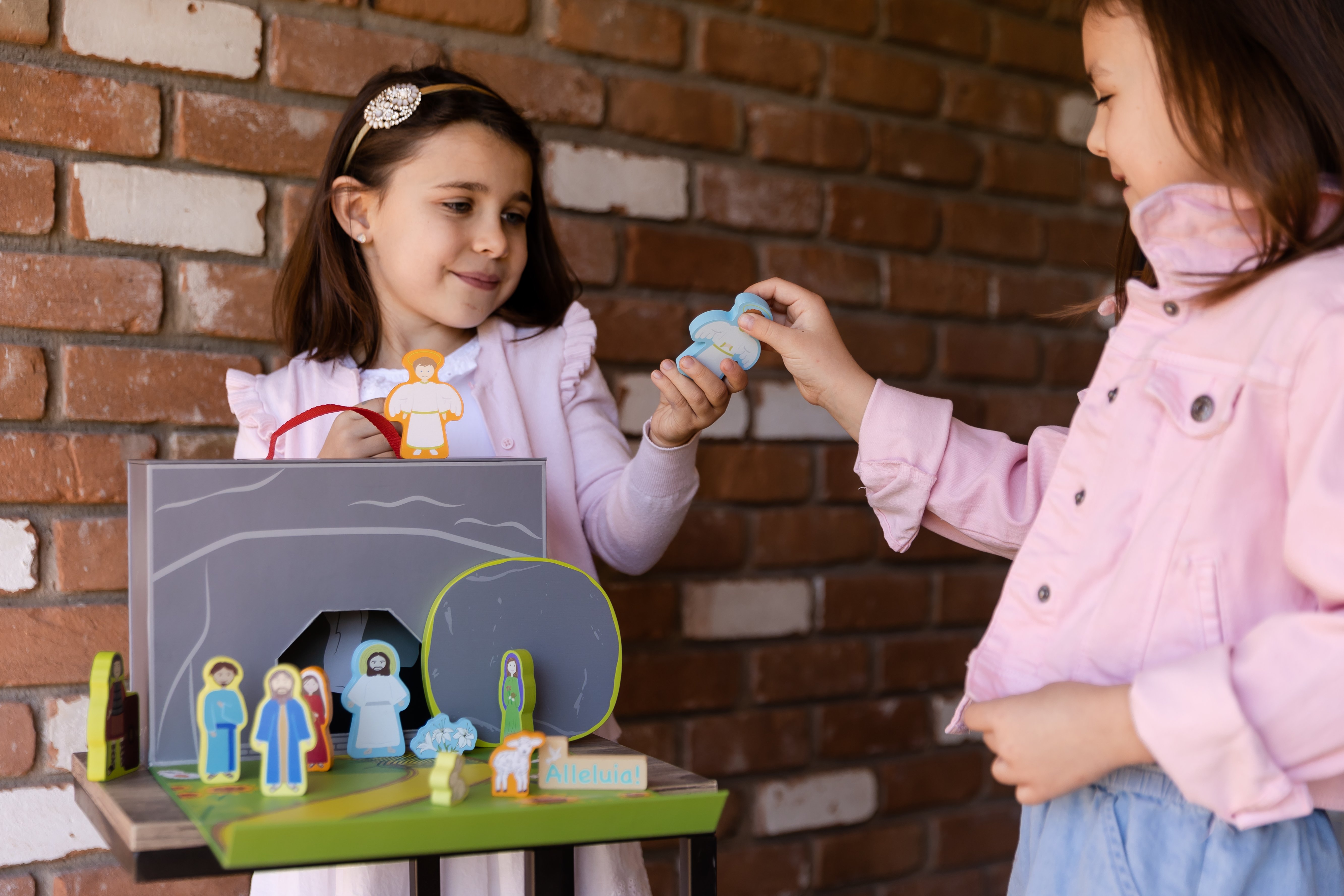 girls playing with Easter playset