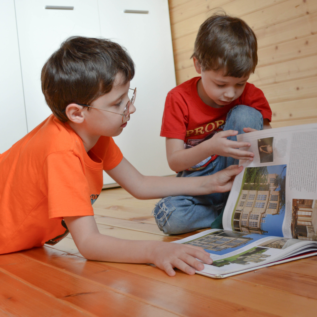 2 boys reading on their own